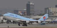 HL7491 @ KLAX - Departing LAX on 25R - by Todd Royer