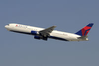 N128DL @ KLAX - Departing LAX on 25R - by Todd Royer