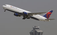 N128DL @ KLAX - Departing LAX on 25R - by Todd Royer