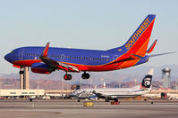 N290WN @ LAS - Southwest Airlines N290WN (FLT SWA2590) from Los Angeles Int'l (KLAX) landing on RWY 1L while Alaska Airlines N570AS is starting takeoff roll on RWY 1R. - by Dean Heald