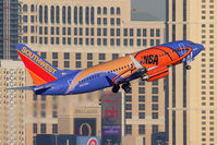 N224WN @ LAS - Southwest Airlines N224WN Slam Dunk ONE (FLT SWA454) climbing out from RWY 1R enroute to Orange County John Wayne Airport (KSNA). - by Dean Heald