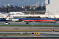 N571AA @ LAX - American Airlines N571AA (FLT AAL2450) from San Francisco Int'l (KSFO) taxiing to the gate with a company vehicle at it's side after arrival on the North Complex. - by Dean Heald
