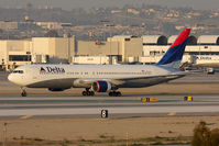 N137DL @ LAX - Delta Airlines N137DL (FLT DAL2089) holding short of RWY 25R after arrival from Hartsfield-Jackson Atlanta Int'l (KATL) - a 4 hour 18 minute flight this day.