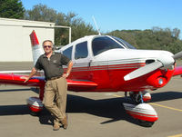 N9701W @ L52 - Bob Glougie standing in front of his Cherokee - by Patti Smith-Glougie
