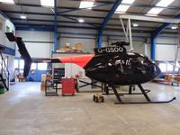 N125KW @ EGBK - MD369E just before repainting with N number - by Simon Palmer