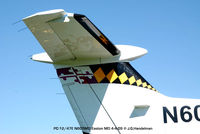 N605MD @ ESN - tail view part of MD State Flag - by J.G. Handelman