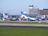 N374AA @ EGCC - American Airlines, along side BMI Airbus A330  G-WWBM - by Chris Hall