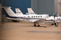 OY-EEF @ EGGW - Beech 200 at a gloomy Luton - by Terry Fletcher