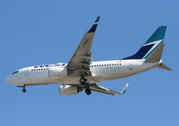 C-FWAQ @ TPA - West Jet 737-700 - by Florida Metal