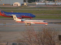 N274WN @ KSTL - PLANE IN BACKGROUND, JUST LANDED - by Gary Schenaman
