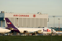 N687FE @ YVR - Cargo loading - by metricbolt
