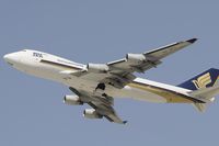 9V-SFJ @ KLAX - Departing LAX on 25R - by Todd Royer