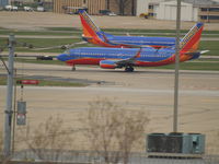 N371SW @ KSTL - TAKING OFF AT ST. LOUIS - by Gary Schenaman