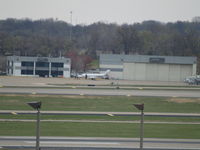 UNKNOWN @ KSTL - TOO FAR AWAY TO READ NUMBER, UNLOADING PASSENGERS - by Gary Schenaman