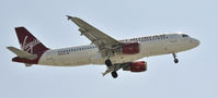 N621VA @ KLAX - Landing 24R at LAX - by Todd Royer