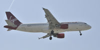 N634VA @ KLAX - Landing 24R at LAX - by Todd Royer