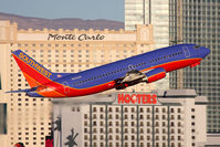 N645SW @ LAS - Southwest Airlines N645SW (FLT SWA1523) climbing out from RWY 1R, with a nice casino backdrop with early morning light, enroute to Ontario Int'l (KONT).