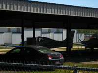 N730C @ KUZA - SR22 parked in hangar - by Connor Shepard