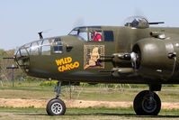 N7947C @ 42VA - Ray Fowler at the controls of the beautifully restored 1944 North American B-25J Wild Cargo going through pre-flight checks before a flight demonstration.