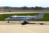N966JM @ CID - Taxiing past the tower on the way to runway 31 - by Glenn E. Chatfield
