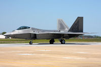 05-4094 @ LFI - USAF Lockheed Martin F-22A Raptor 05-4094 of the 94th FS Spads - Hat-in-the-Ring Gang with Major Dave Zeke Skalicky at the controls taxiing to RWY 8 to perform the F-22A Raptor Demo and Heritage Flight during Friday's practice.