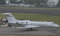 N225CX @ TNCM - taxing runway 10 - by daniel jef