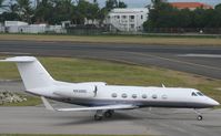 N930DC @ TNCM - taxing runway 10