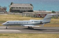 N999LX @ TNCM - taking off