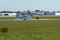 N6935N @ LAL - Departing Sun N Fun 2009 - Lakeland, Florida. N17334 in the background - by Bob Simmermon