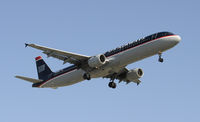 N176UW @ KLAX - Landing 24R at LAX - by Todd Royer