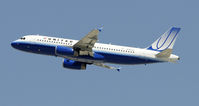 N497UA @ KLAX - Departing LAX on 25R - by Todd Royer