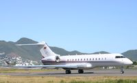 N305CC @ TNCM - taxing runway 10