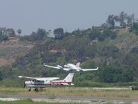N421PR @ POC - Getting airbourne after passing N12915 who was waiting for clearence to taxi back to 26L - by Helicopterfriend
