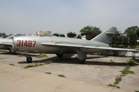 31487 - Shenyang J-5   Located at Datangshan, China - by Mark Pasqualino