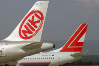 OE-LNJ @ LOWG - Nice view. One person, two airlines. - by Robert Schöberl