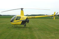 G-CBZF @ EGCL - Robinson R22 at Conington - by Terry Fletcher