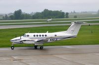 N312JC @ CID - Taxiing from Landmark to Runway 27 - by Glenn E. Chatfield