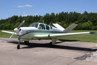 N3495B @ SFQ - 1954 Beechcraft E-35 Bonanza N3495B on display at the 2009 Virginia Regional Festival of Flight at Suffolk Executive Airport. - by Dean Heald