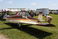 N70096 @ SFQ - The pilot checks the wires of this 1994 Carruthers Super Cat before flight while a friend looks on. This aircraft looks like a miniature version of an AgCat. Nice! - by Dean Heald
