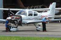 G-PHEW @ EGBJ - Cirrus SR22 receiving attention at Gloucestershire Airport - by Terry Fletcher