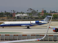 N740SK @ LAX - United Express rolling westbound on 24L - by Helicopterfriend