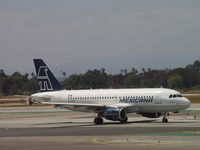 N925MX @ LAX - Taxiing to Runway 24L - by Helicopterfriend