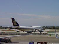 9V-SPJ @ LAX - Turning onto Runway 24L for take off - by Helicopterfriend