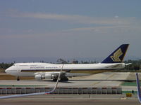 9V-SPJ @ LAX - Starting roll out on 24L just before a Korean Air 747 lands on 24R - by Helicopterfriend