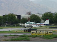 N17803 @ POC - Rolling out on 26L on a rainy day - by Helicopterfriend