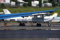 N714UC @ HEF - Parked quietly on the ramp - by Paul Perry