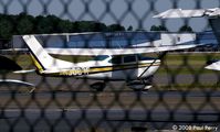 N3087F @ HEF - Another Cessna on a packed ramp
