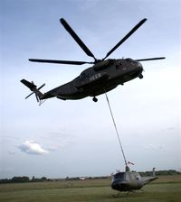 84 50 @ EDAD - CH 53 transport heli of german Bundeswehr is lifting a demaged Huey - by Holger Zengler