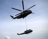 84 50 @ EDAD - CH 53 transport heli of german Bundeswehr is lifting a demaged Huey - by Holger Zengler