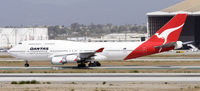 VH-OEH @ KLAX - Taxi to gate - by Todd Royer